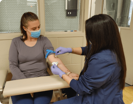 Doctor giving a vaccine to a patient Doctor giving a vaccine to a patient