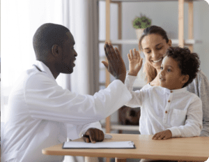 Doctor clapping hands with kid
