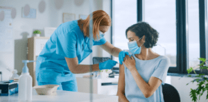 Doctor giving patient a shot