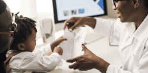 Doctor talking to parent and child