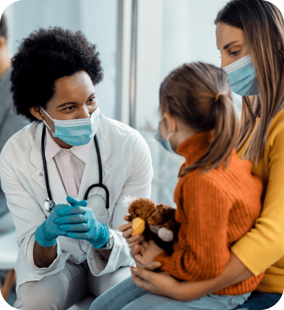 Female doctor talking to kid patient